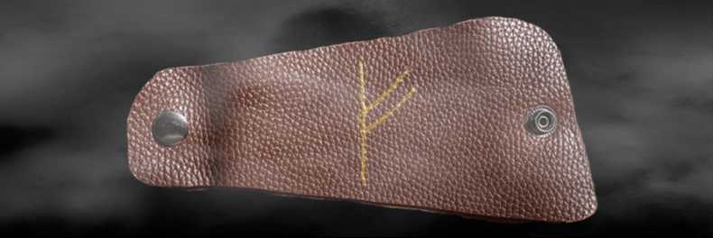 Runa Fehu na pele como um amuleto da sorte